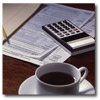 tax forms, coffe cup, and calculator